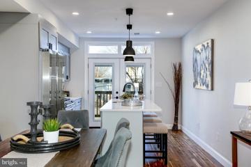 Kitchen island and doors to the private balcony